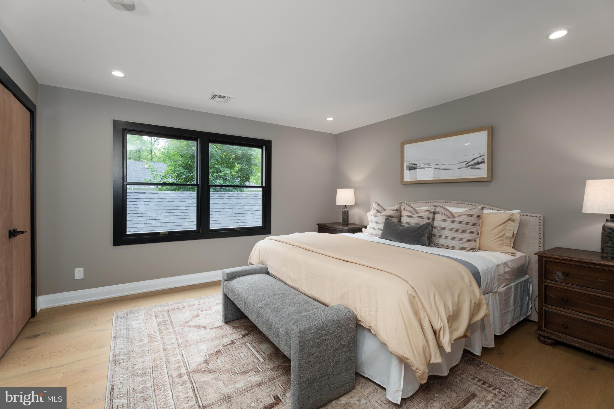 374 Cherry Hill Road Princeton, NJ 08540 - Photo 28 of 42 a spacious bedroom with a bed and a large window