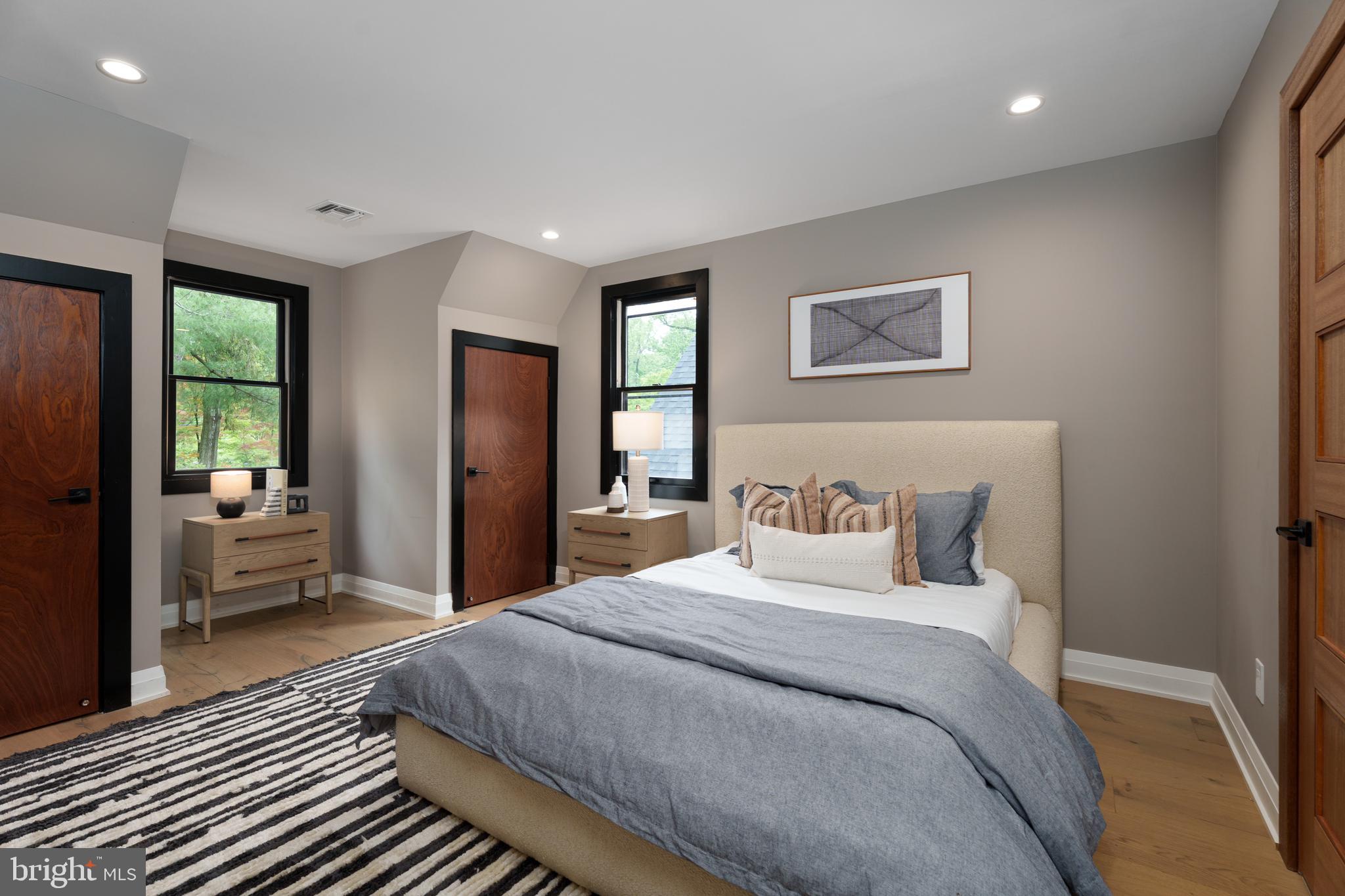 374 Cherry Hill Road Princeton, NJ 08540 - Photo 30 of 42 a bedroom with a large bed and a couch