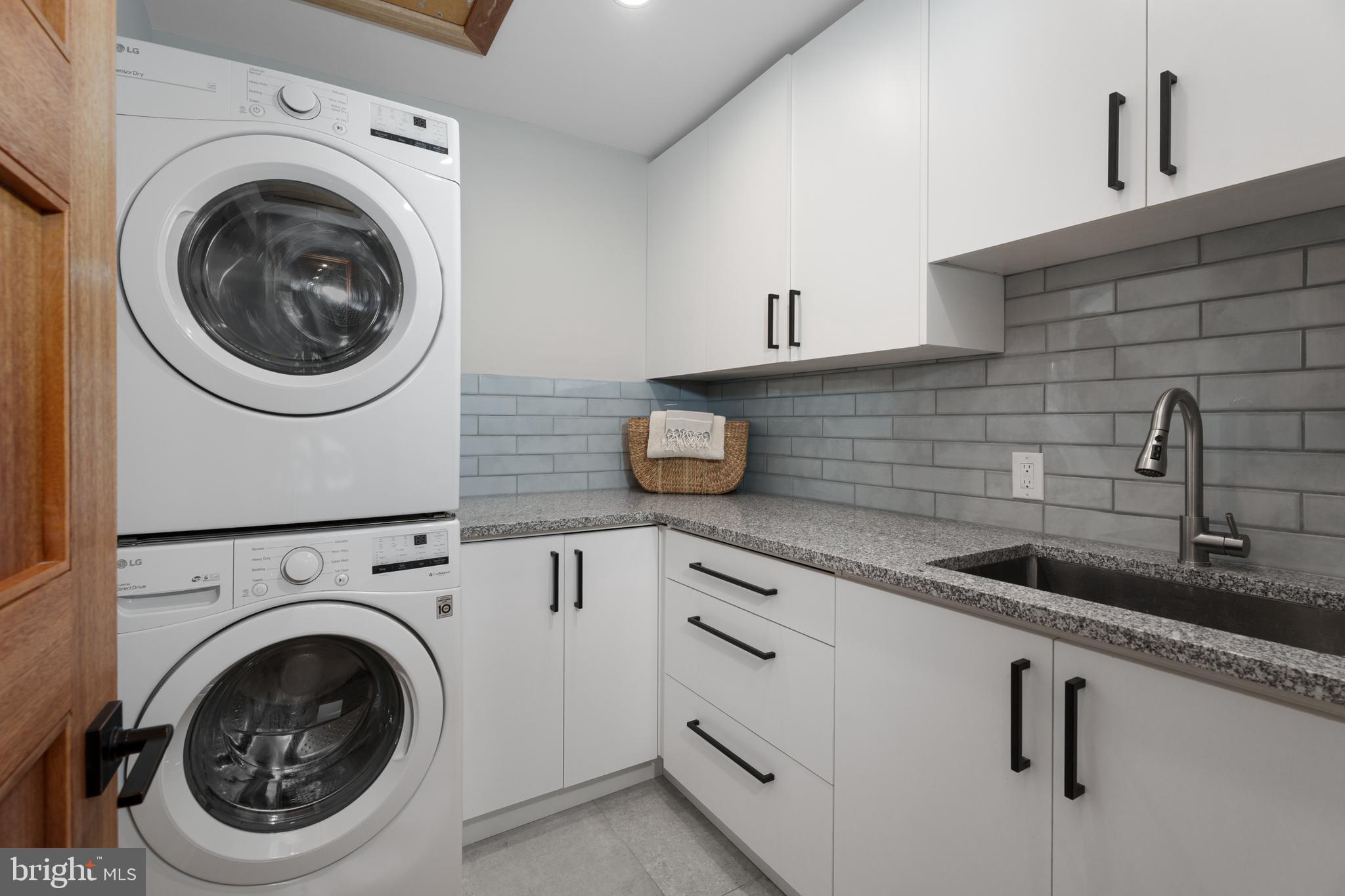 374 Cherry Hill Road Princeton, NJ 08540 - Photo 33 of 42 a utility room with sink dryer and washer