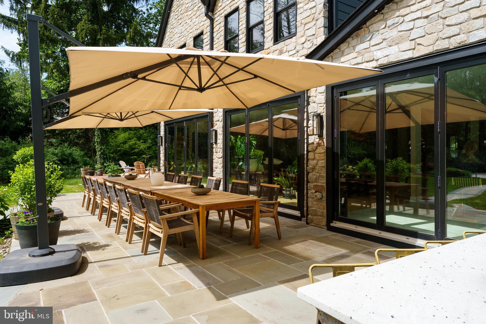 374 Cherry Hill Road Princeton, NJ 08540 - Photo 38 of 42 a view of a patio with table and chairs under an umbrella