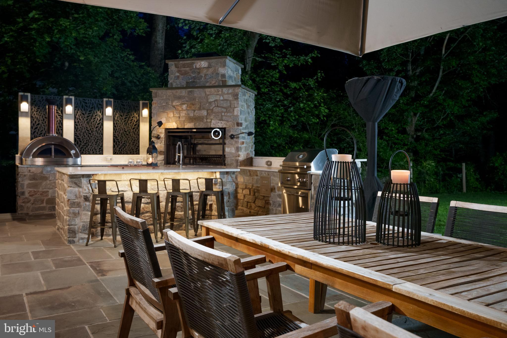 374 Cherry Hill Road Princeton, NJ 08540 - Photo 41 of 42 a view of a patio with table and chairs with wooden floor and fence