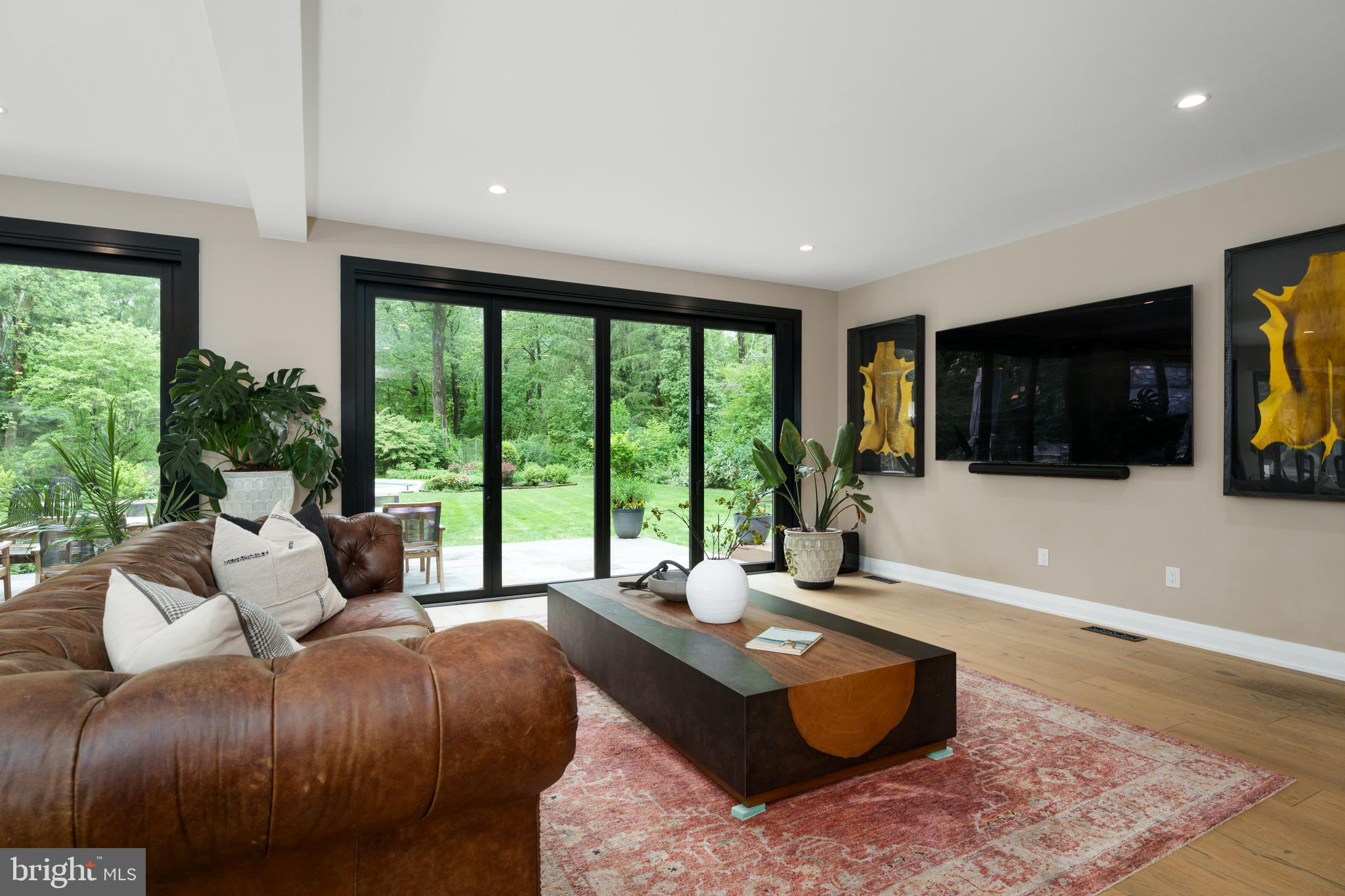 374 Cherry Hill Road Princeton, NJ 08540 - Photo 7 of 42 a living room with a large window and a flat screen tv