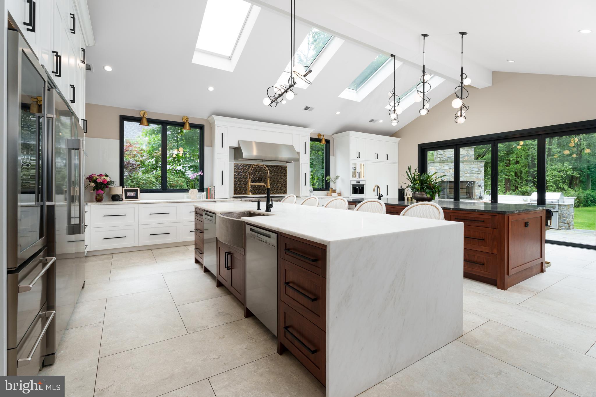 374 Cherry Hill Road Princeton, NJ 08540 - Photo 10 of 42 a kitchen with a sink a counter top space appliances and cabinets