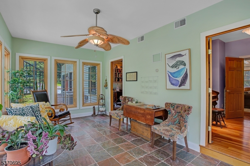121 Stanton Mountain Road Lebanon, NJ 08833 - Photo 23 of 50 a dining room with furniture a livingroom with furniture and wooden floor