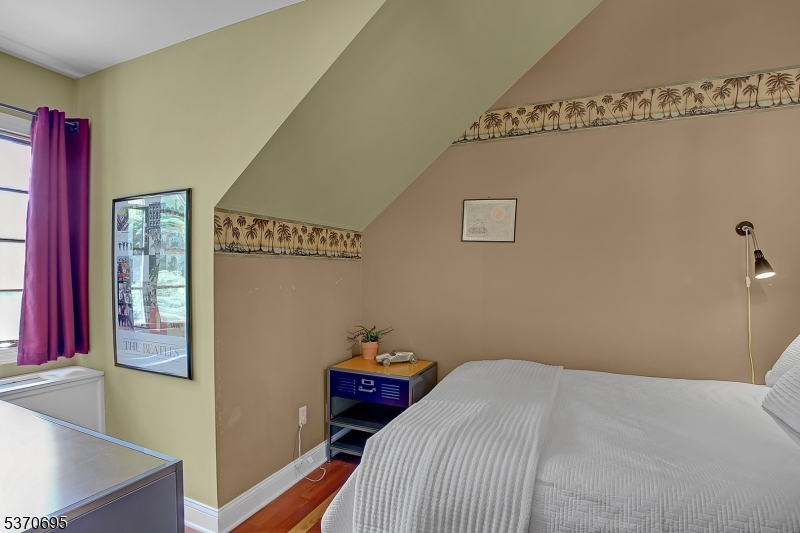 121 Stanton Mountain Road Lebanon, NJ 08833 - Photo 38 of 50 a bedroom with a bed and a table in it