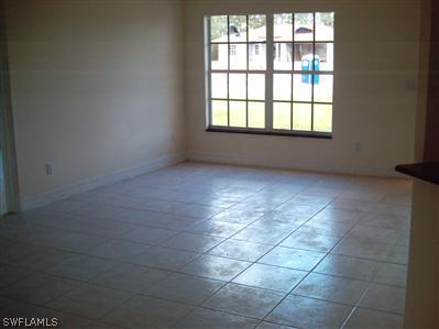 Undisclosed Address Lehigh Acres, FL 33974 - Photo 4 of 7 an empty room with windows