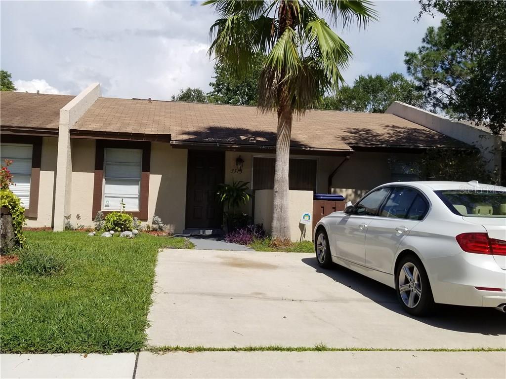 a car parked in front of a house