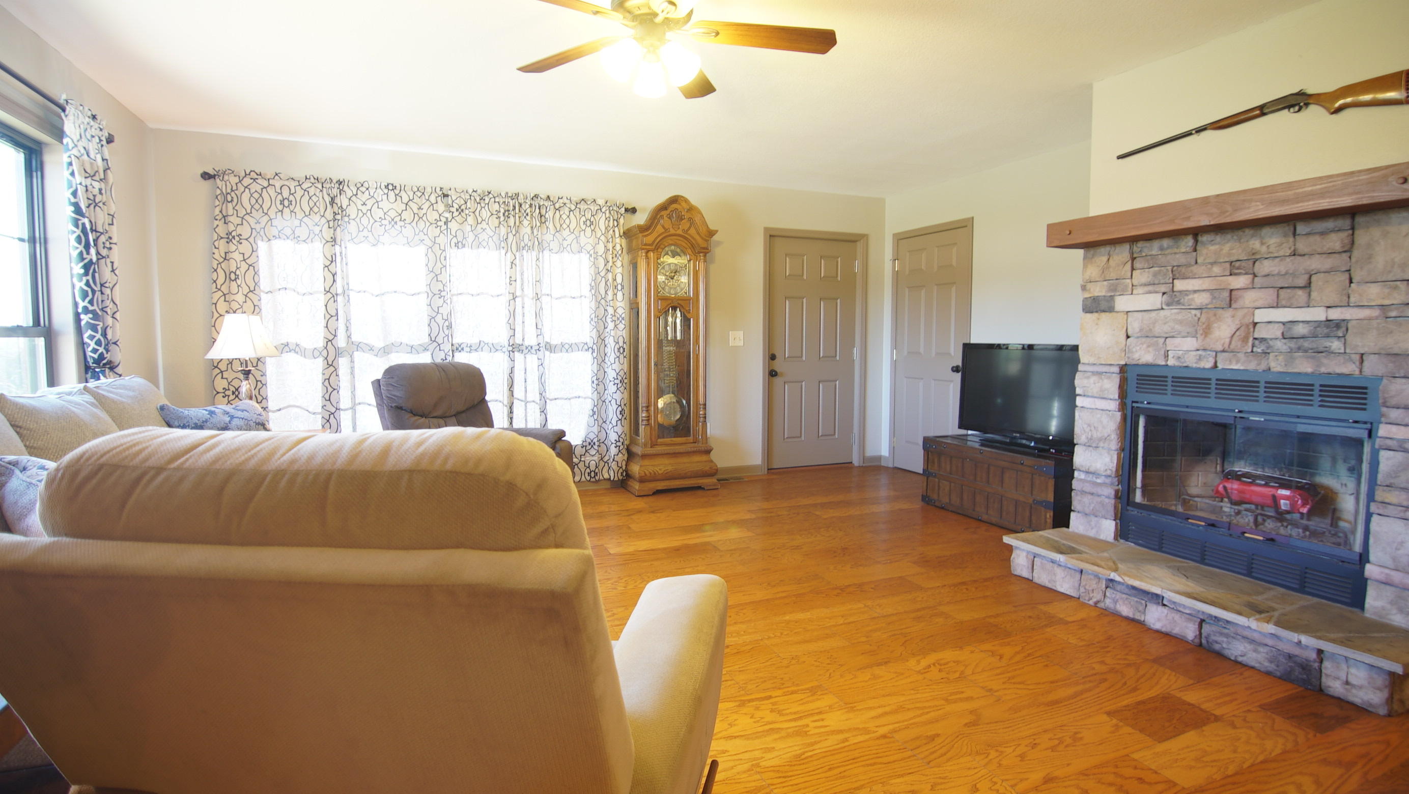 5711 Sinking Creek Road Greenback, TN 37742 - Photo 11 of 38 Living room with stone fireplace