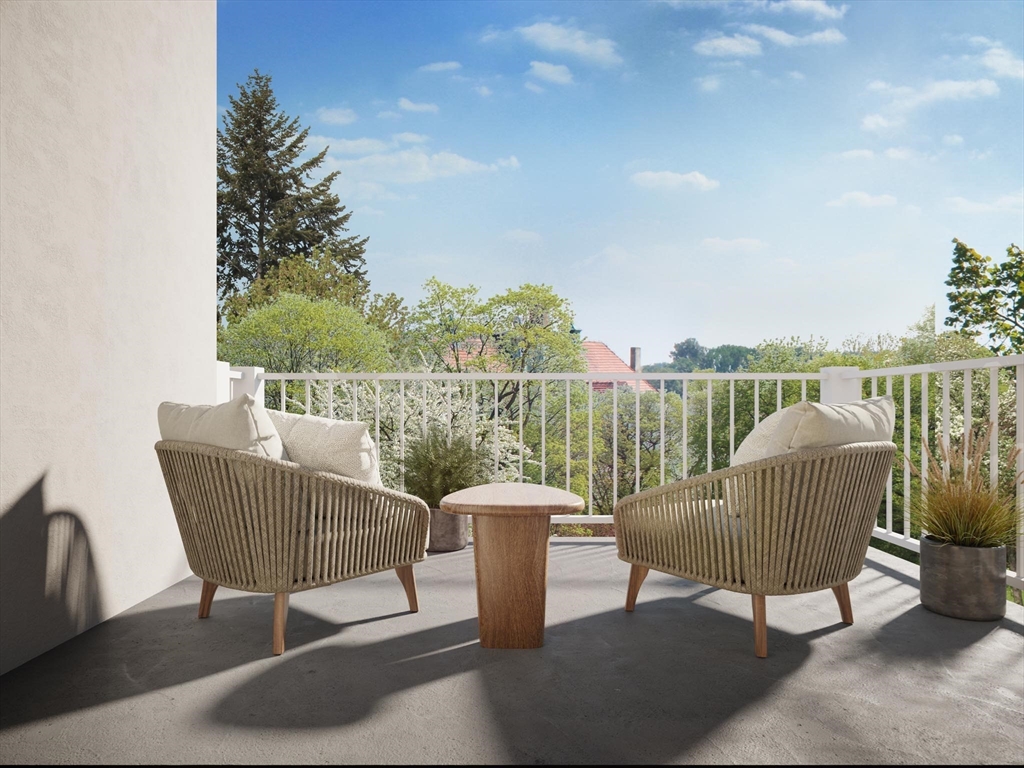 16 Stearns Road, Unit 104 Wellesley, MA 02482 - Photo 6 of 6 a view of a chair and table on the terrace