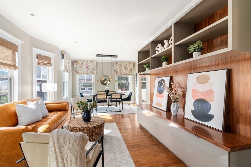 85 Manet Road Newton, MA 02467 - Photo 6 of 40 a living room with furniture wooden floor and floor to ceiling windows