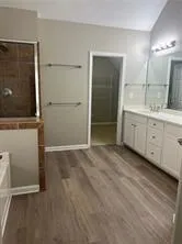 a view of a bathroom with mirror