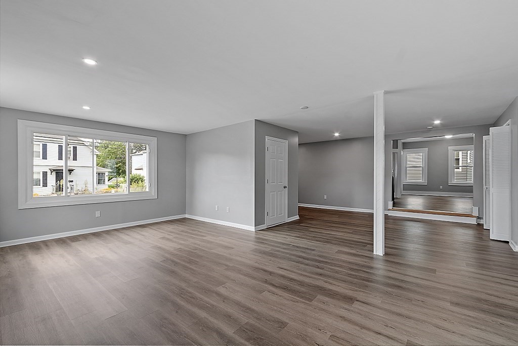 46 West Meadow Road Lowell, MA 01854 - Photo 12 of 42 a view of an empty room with window and wooden floor