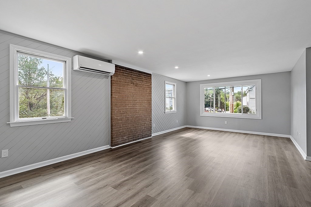46 West Meadow Road Lowell, MA 01854 - Photo 13 of 42 a view of an empty room with wooden floor and a window