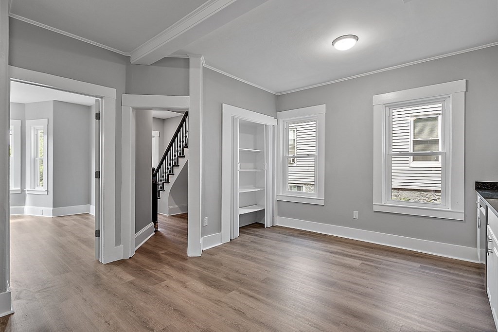 46 West Meadow Road Lowell, MA 01854 - Photo 20 of 42 an empty room with wooden floor closet and windows