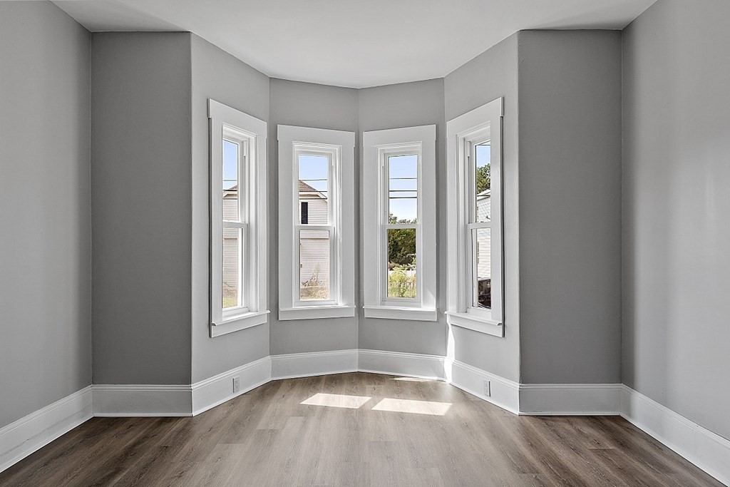 46 West Meadow Road Lowell, MA 01854 - Photo 21 of 42 wooden floor in an empty room with a window