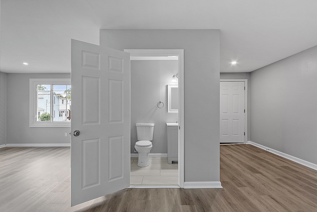 46 West Meadow Road Lowell, MA 01854 - Photo 30 of 42 a view of a room with wooden floor and a toilet