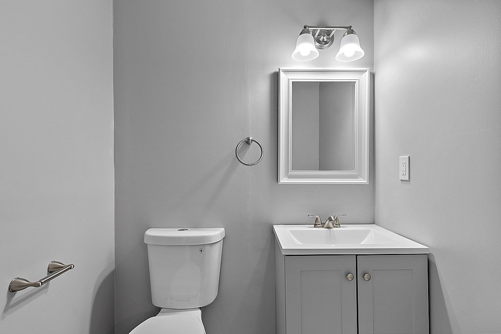 46 West Meadow Road Lowell, MA 01854 - Photo 31 of 42 a bathroom with a toilet a sink and mirror