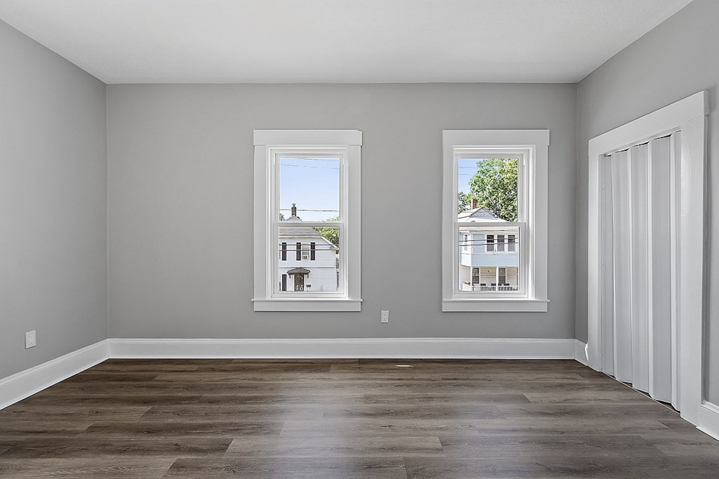 46 West Meadow Road Lowell, MA 01854 - Photo 33 of 42 a view of an empty room with wooden floor and a window