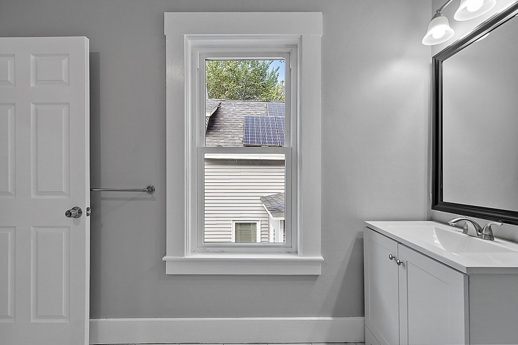 46 West Meadow Road Lowell, MA 01854 - Photo 39 of 42 a bathroom with a sink and a window