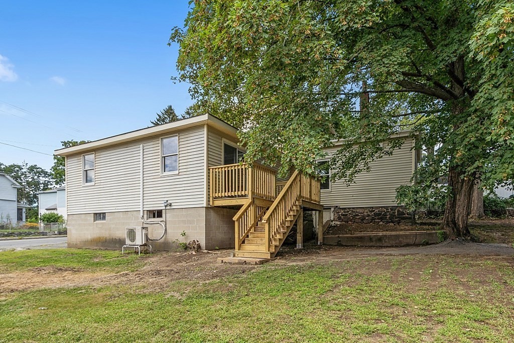 46 West Meadow Road Lowell, MA 01854 - Photo 41 of 42 a view of a house with a backyard