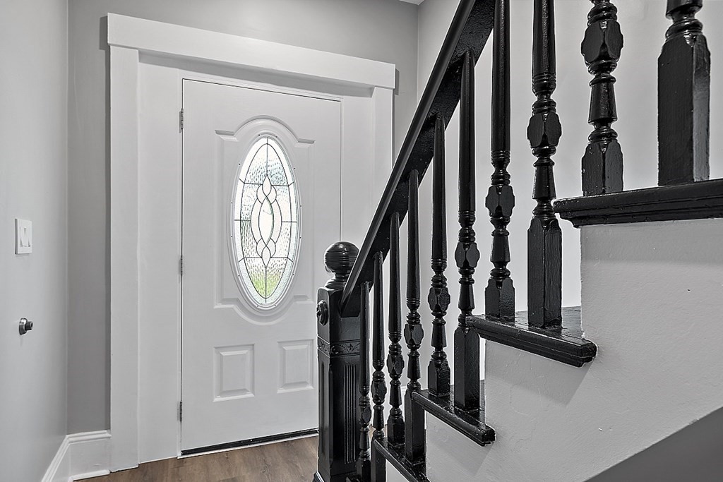 46 West Meadow Road Lowell, MA 01854 - Photo 5 of 42 a view of staircase with wooden floor and a window