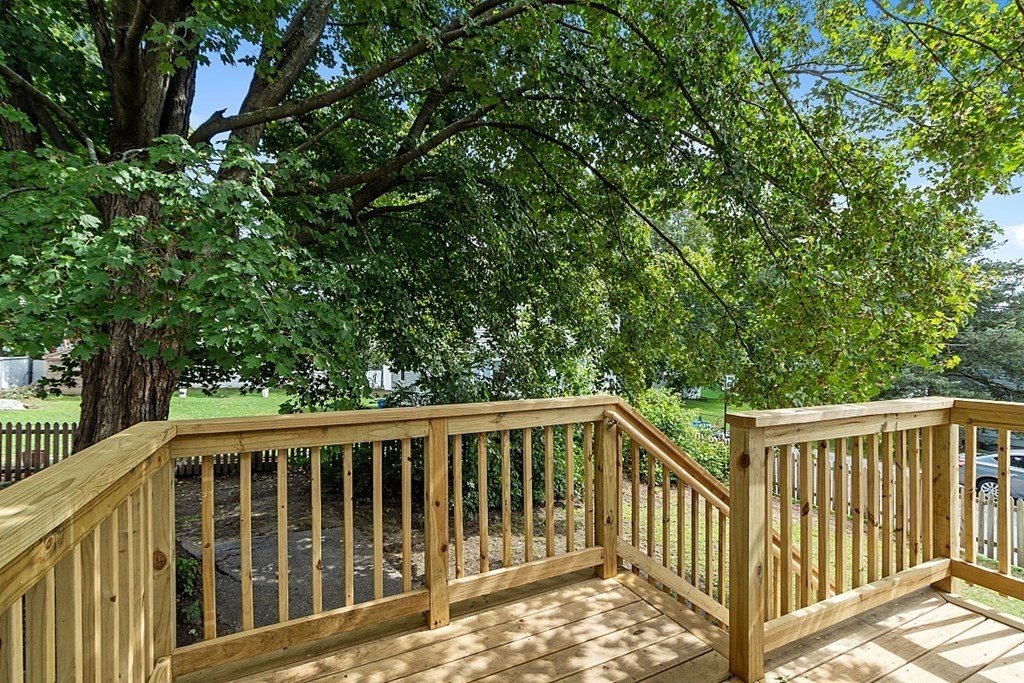 46 West Meadow Road Lowell, MA 01854 - Photo 7 of 42 a view of a wooden fence and trees