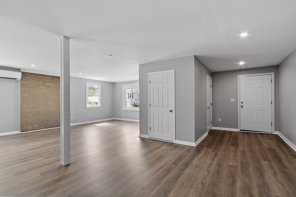 46 West Meadow Road Lowell, MA 01854 - Photo 8 of 42 a view of an empty room with wooden floor and a window