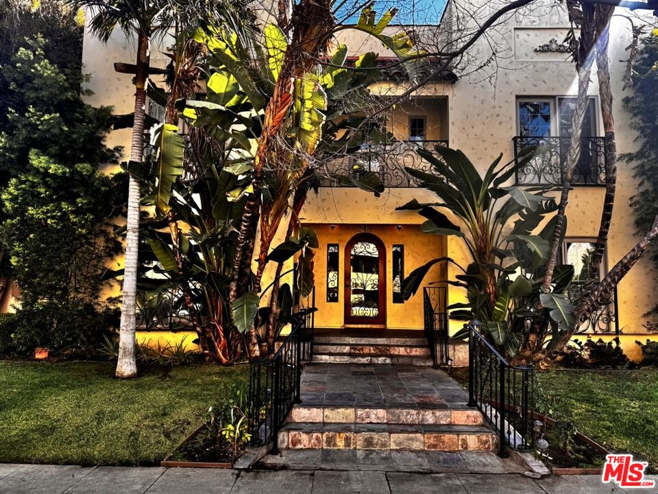 248 South Reeves Drive, Unit 1 Beverly Hills, CA 90212 - Photo 1 of 1 a front view of a house with a yard