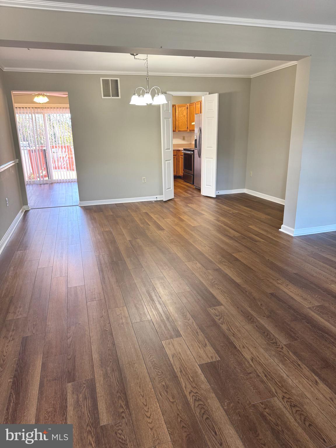 209 Hunters Run Terrace Bel Air, MD 21015 - Photo 5 of 17 wooden floor in an empty room with a window