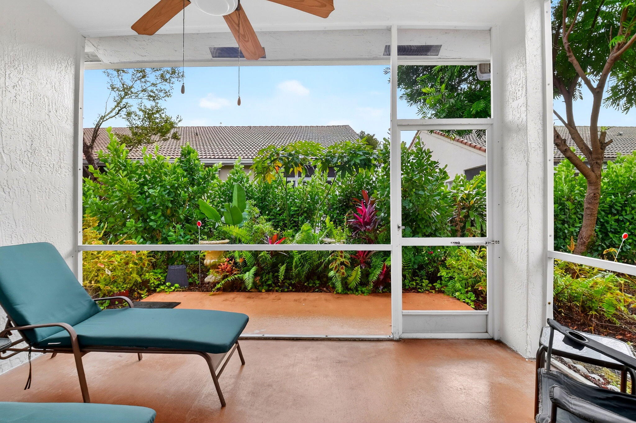 6164 Petunia Road Delray Beach, FL 33484 - Photo 31 of 62 a view of a chairs and table in a balcony