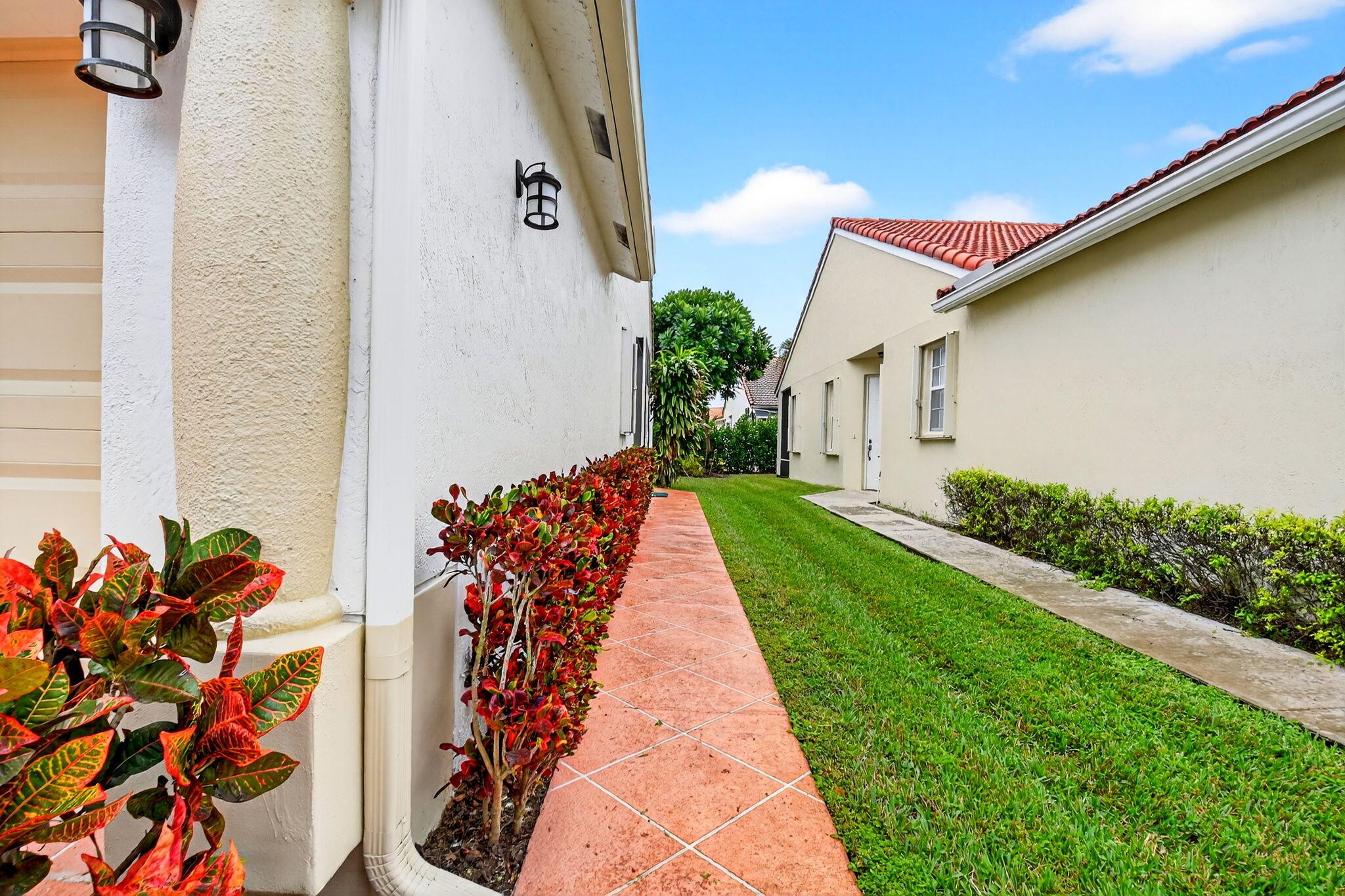 6164 Petunia Road Delray Beach, FL 33484 - Photo 4 of 62 a view of a pathway with a yard