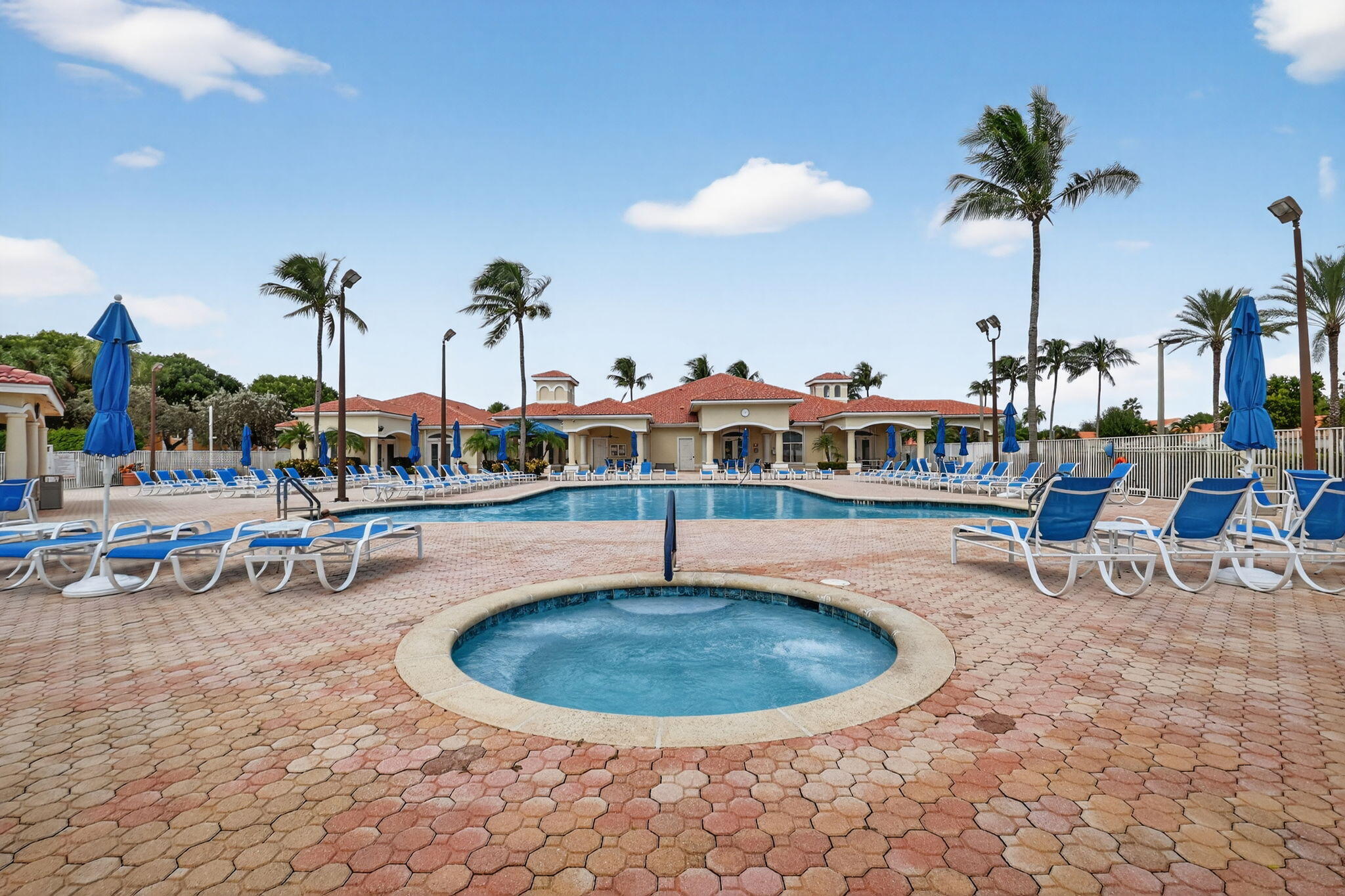 6164 Petunia Road Delray Beach, FL 33484 - Photo 57 of 62 a view of a swimming pool with outdoor seating
