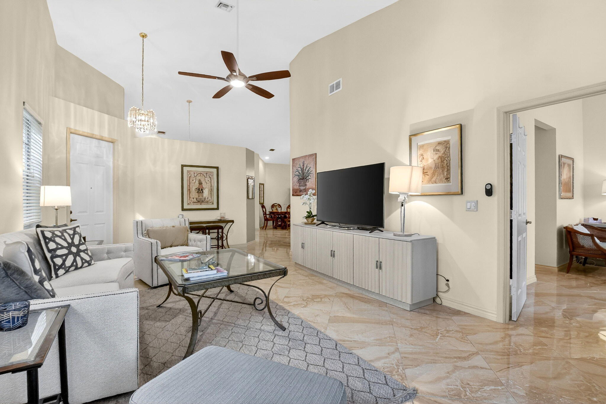 6164 Petunia Road Delray Beach, FL 33484 - Photo 8 of 62 a living room with furniture and a flat screen tv