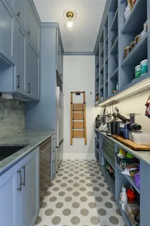 a kitchen with stainless steel appliances granite countertop a sink and cabinets