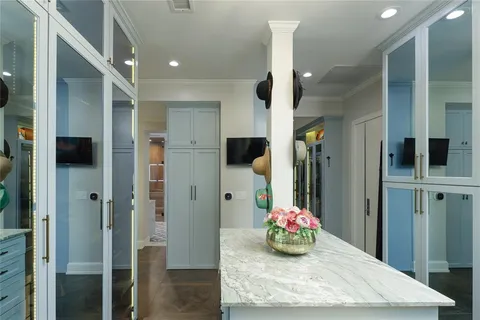 a bathroom with a sink mirror and shower