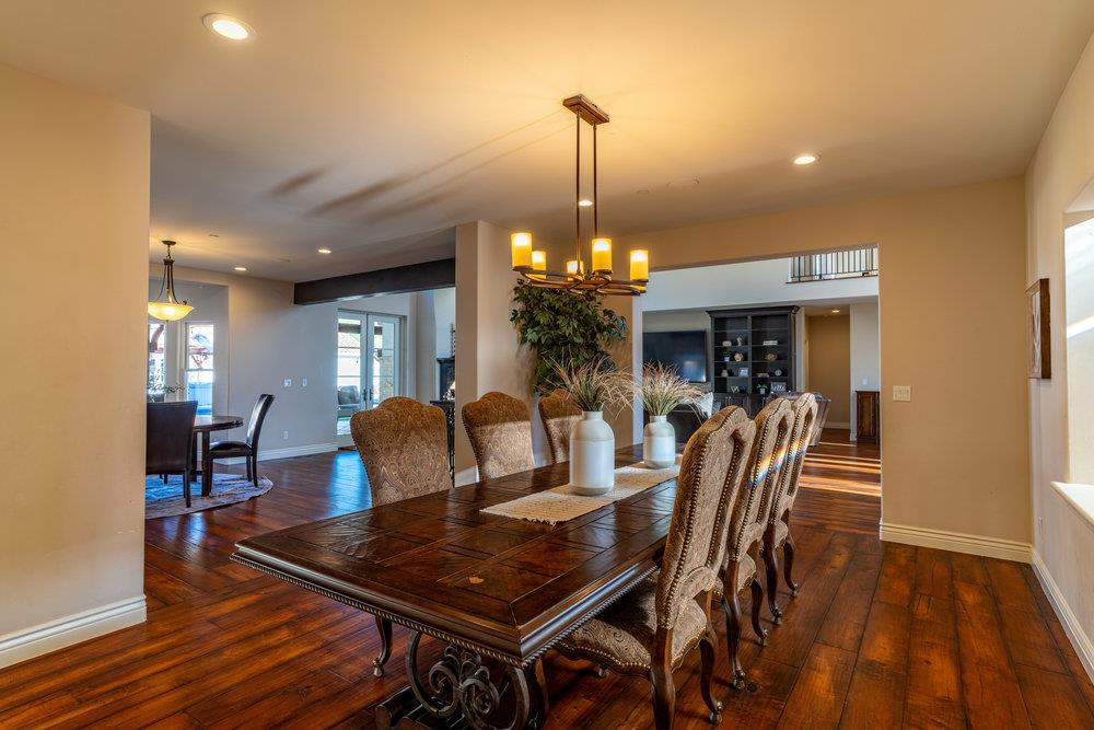 2985 Day Road Gilroy, CA 95020 - Photo 19 of 72 a dining room with furniture a chandelier and wooden floor