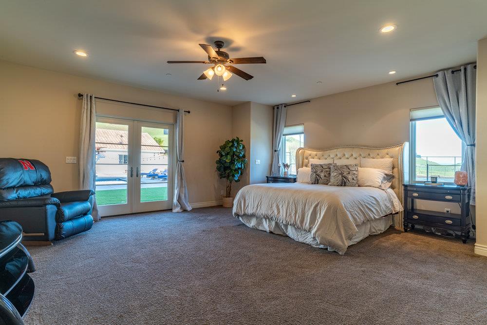 2985 Day Road Gilroy, CA 95020 - Photo 27 of 72 a spacious bedroom with a bed and a chandelier