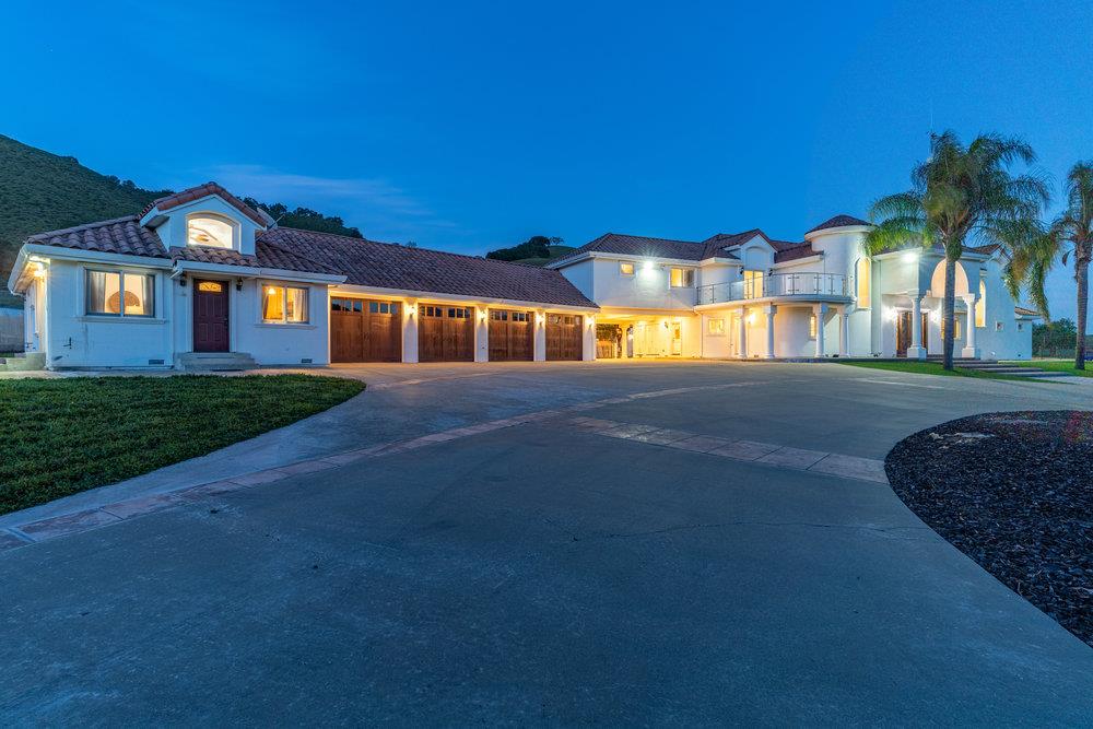 2985 Day Road Gilroy, CA 95020 - Photo 4 of 72 a front view of a house with a yard and garage