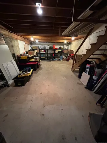 a view of a pathway with a flower garden