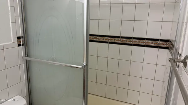 a view of chandelier fan and window