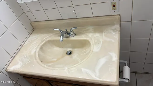 a view of a chandelier fan and a clock