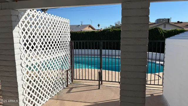 a view of a balcony with two chairs