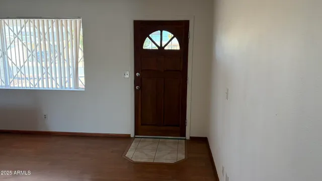 a kitchen with a stove top oven and cabinets