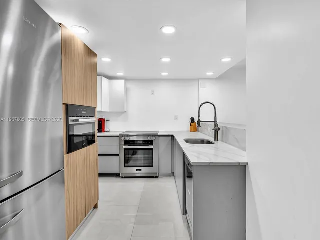 a view of a backyard with plants and a lake view