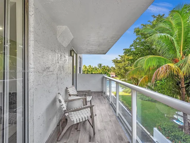 a view of roof deck with outdoor seating and city view