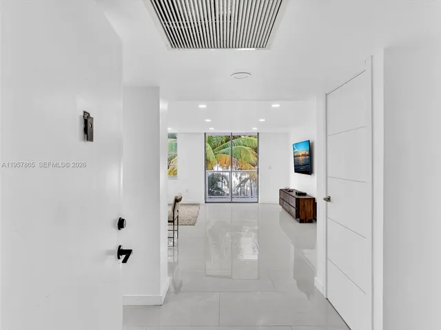 a kitchen with stainless steel appliances a sink and a refrigerator