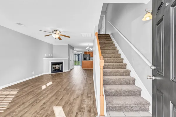 a view of an entryway with wooden floor