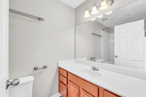 a bathroom with a sink double vanity and a mirror