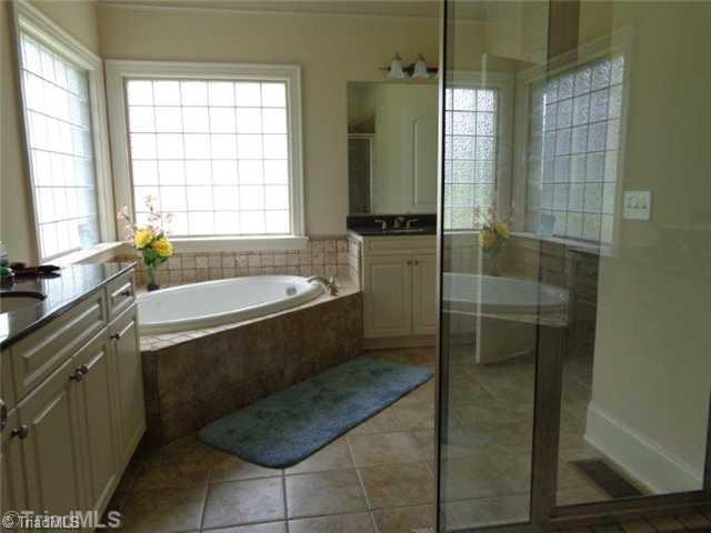 1702 Rita Court Oak Ridge, NC 27310 - Photo 13 of 16 Master Bath/Spa. Large master bath has deep jetted tub, large shower & double vanity