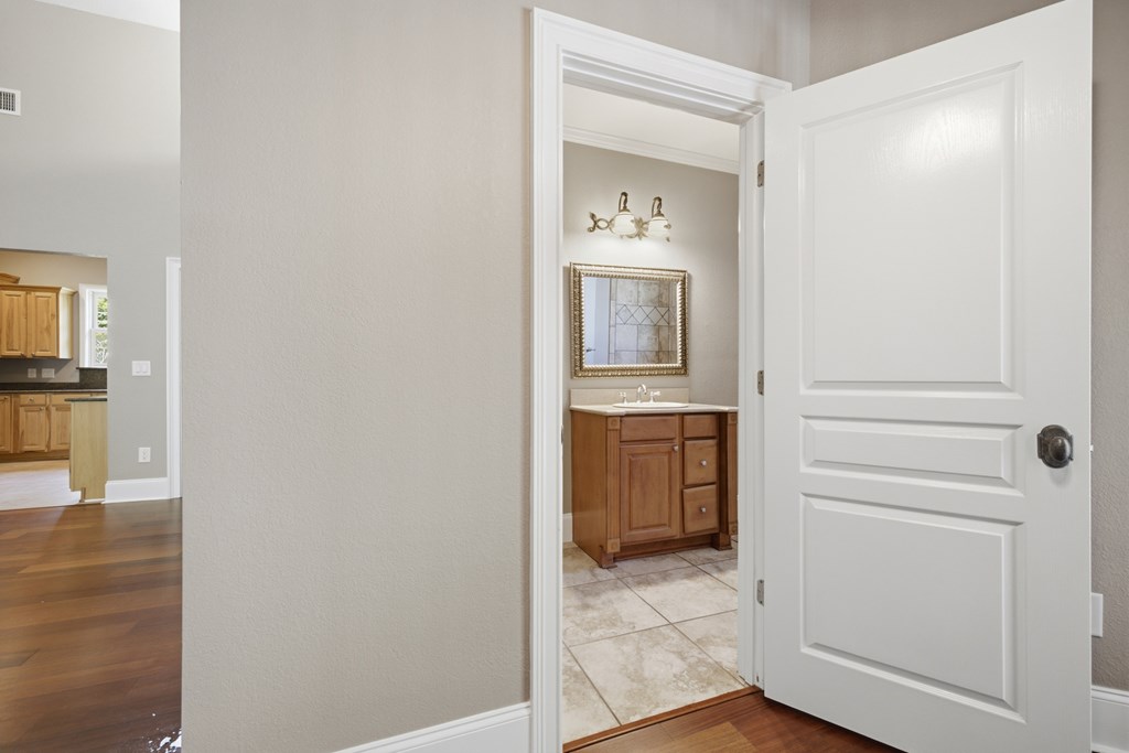 2143 Ridgecrest Circle, Unit 1 Hiawassee, GA 30546 - Photo 27 of 53 a en suite bathroom with a sink and a mirror